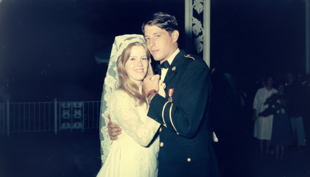 wedding photo of a tipper gore in lace gown and al gore in military uniform