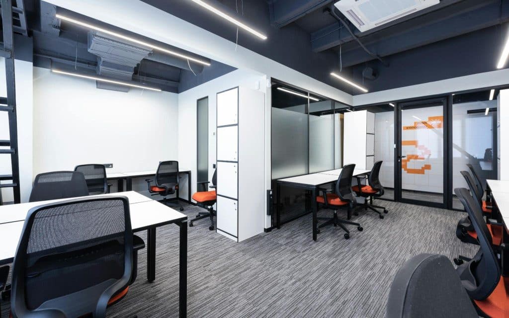 Open space office with tables and chairs.
