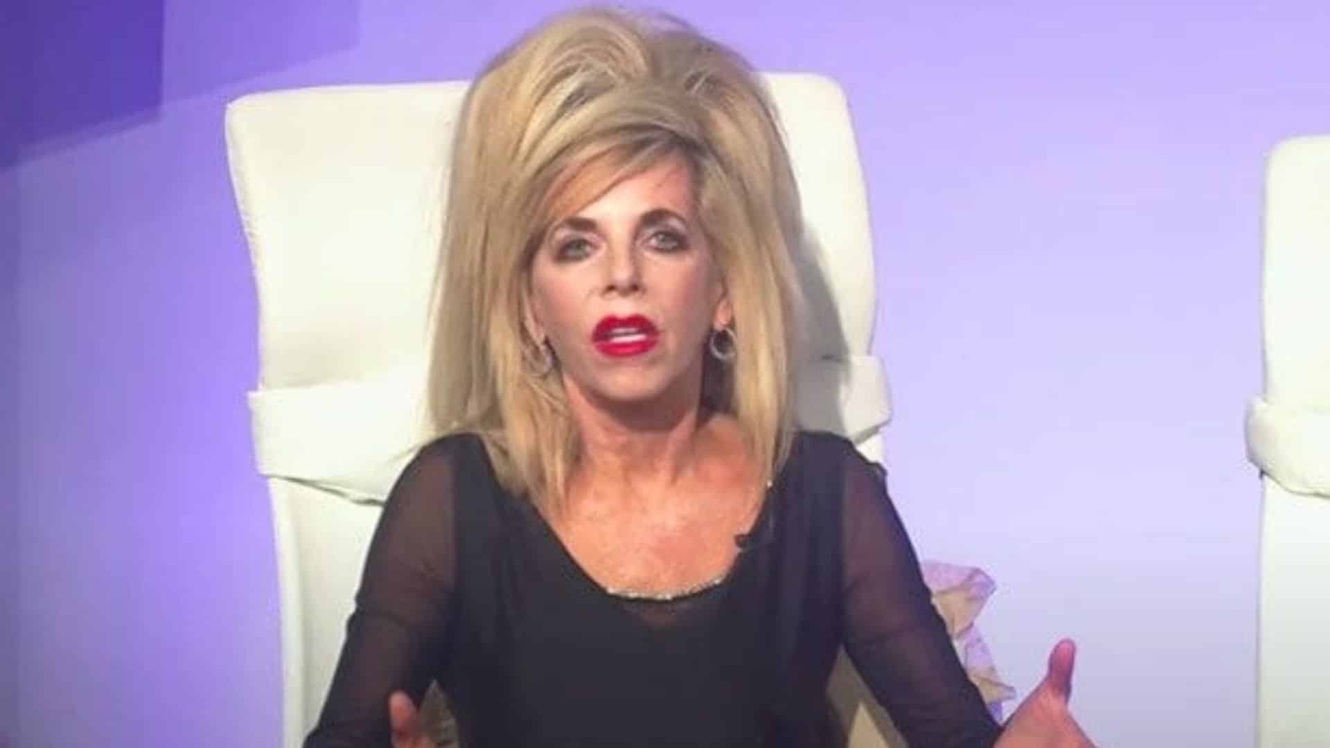 gwen shamblin speaking during a televised appearance wearing bold makeup and her signature high blonde hairstyle.jpeg