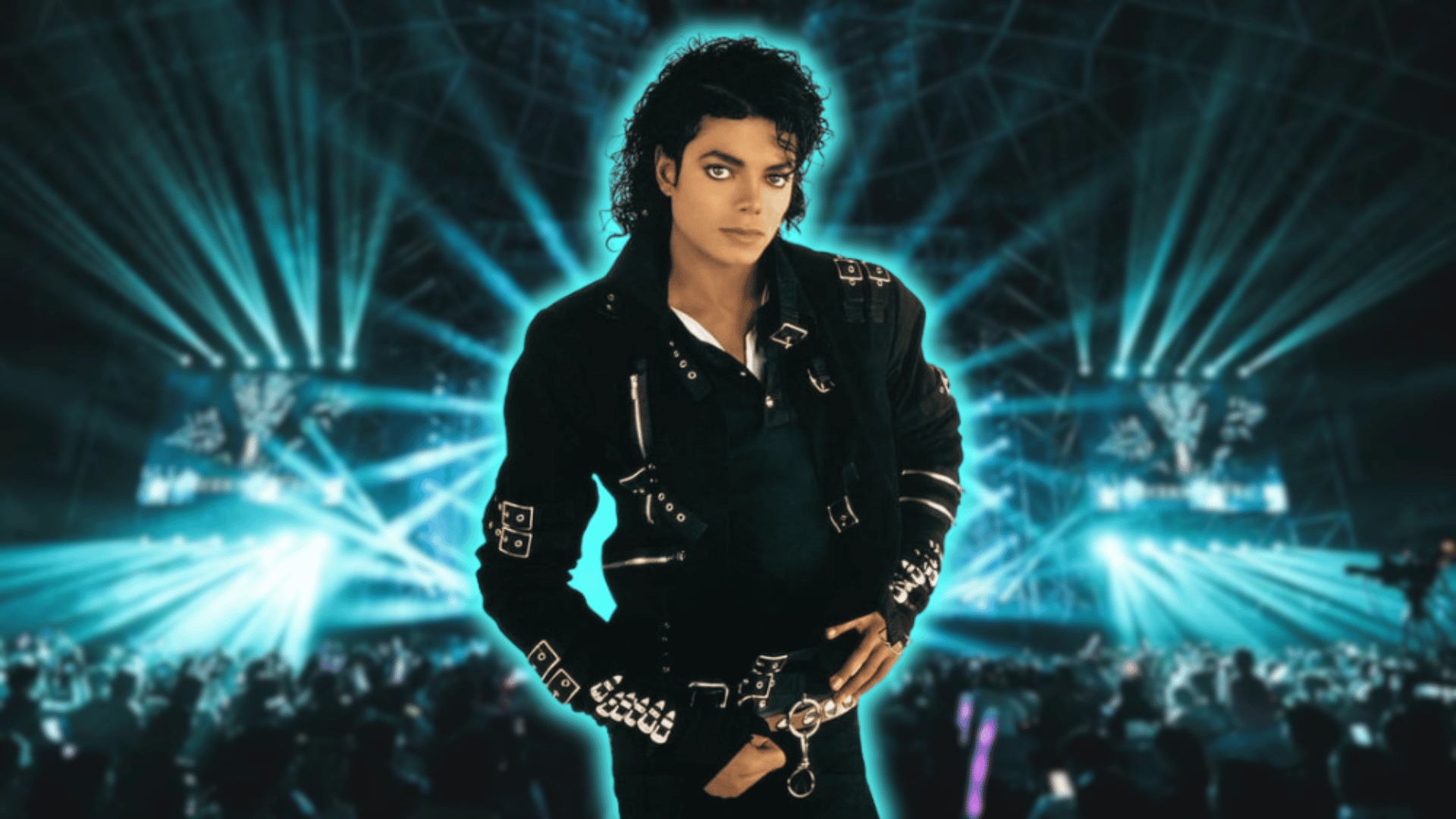 Michael Jackson standing on stage with blue concert lights in background.