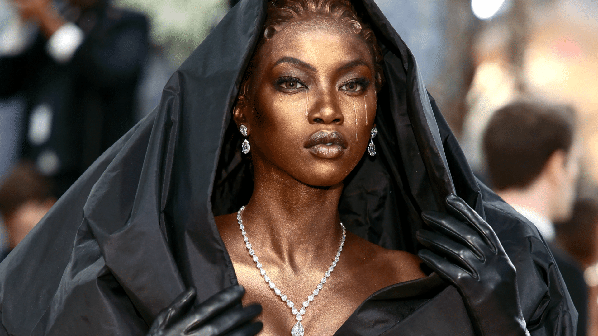 Anok Yai at Met Gala 2026 in a custom Balenciaga Black Madonna look with sculpted details and a dramatic hooded gown.