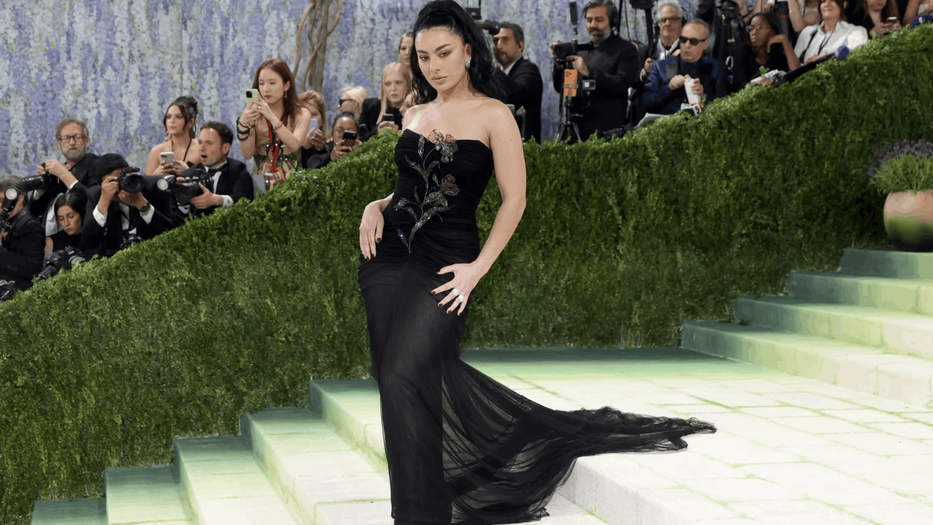Charli XCX in a semi-sheer Saint Laurent gown, referencing Van Gogh’s Irises.