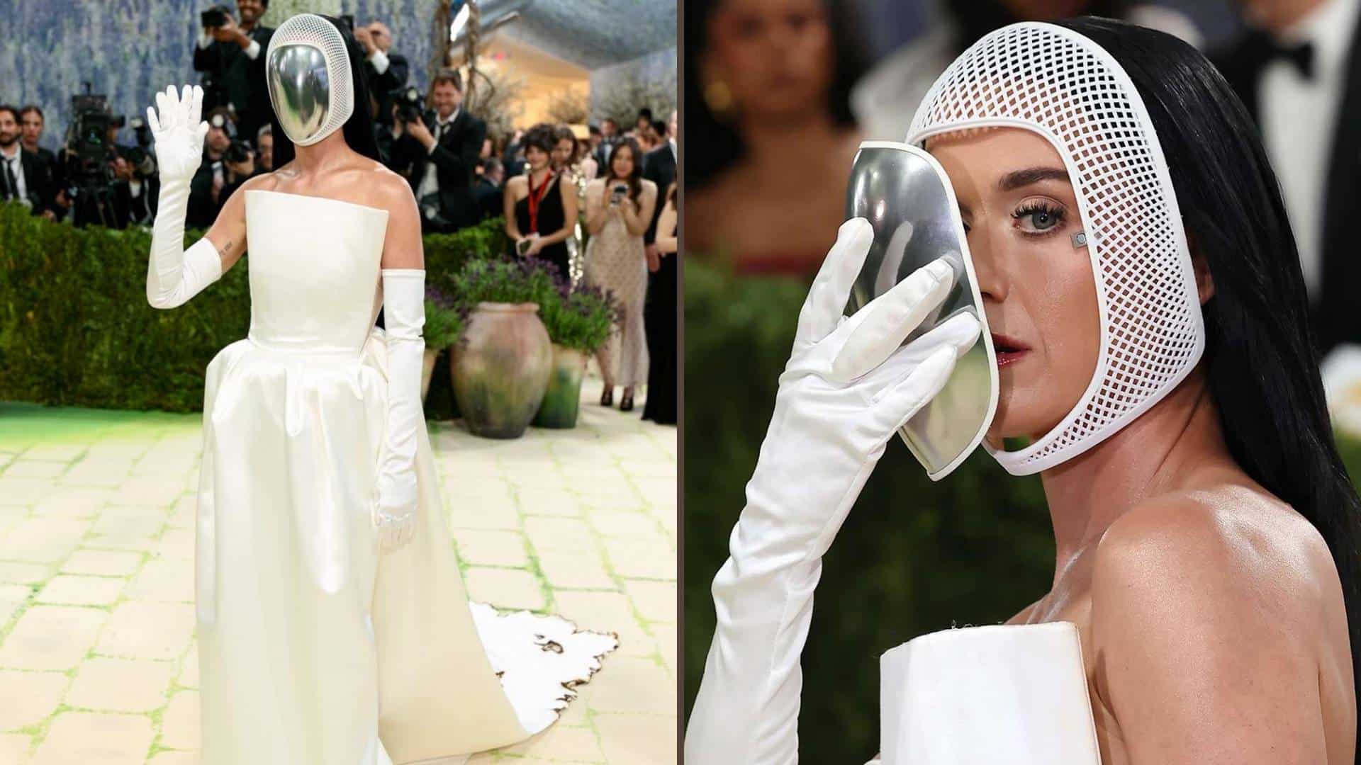 Katy Perry in a futuristic white gown with a metallic mask at the Met Gala.