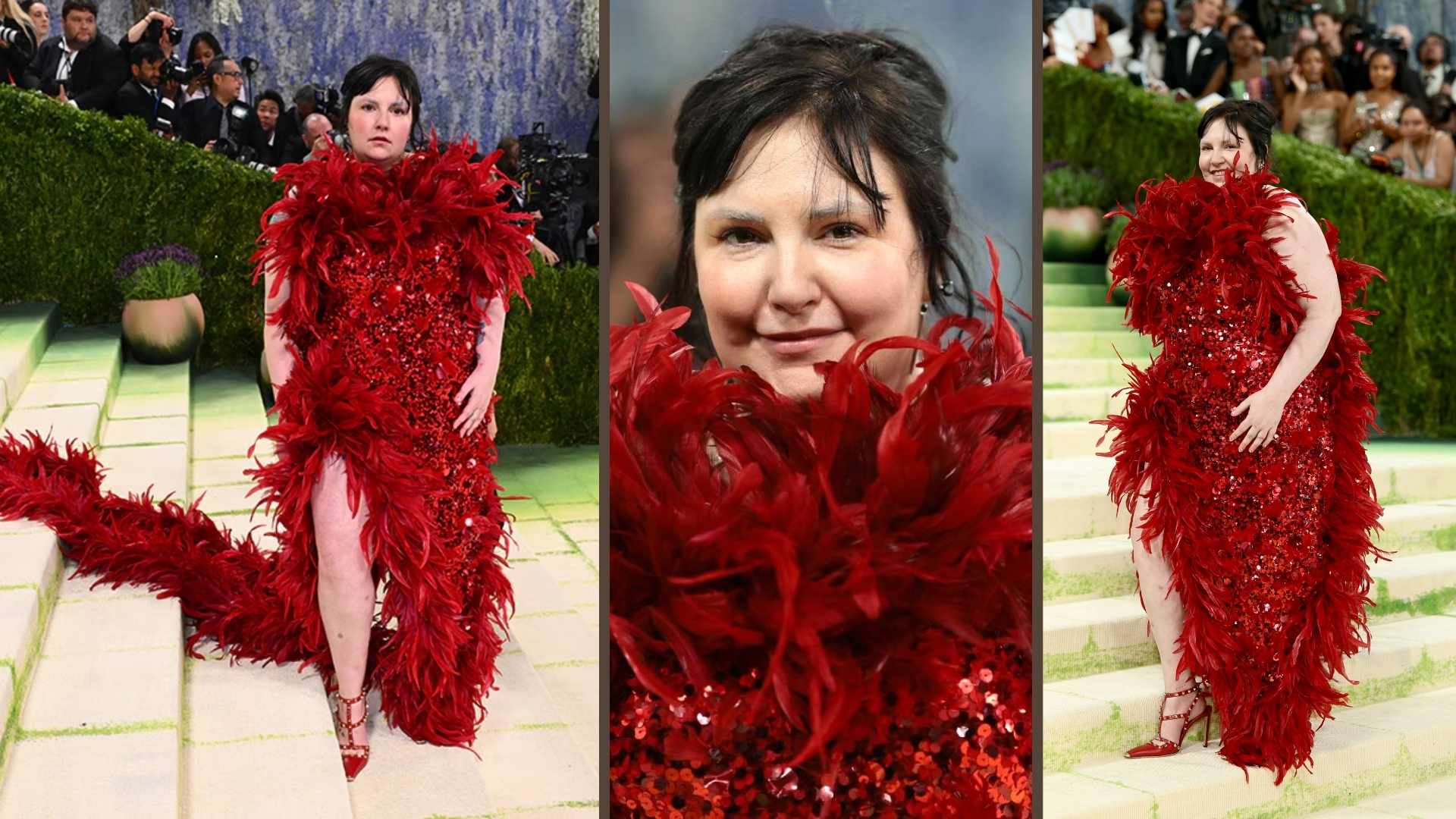 Lena Dunham in a red feathered, sequined dress with a dramatic train at the Met Gala.