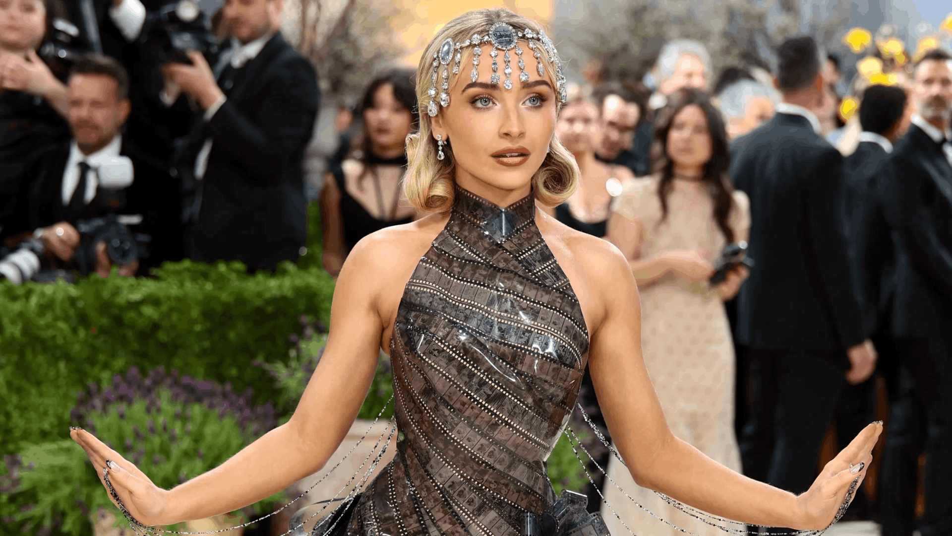 Sabrina Carpenter in a Dior dress constructed from 1954 film strips.
