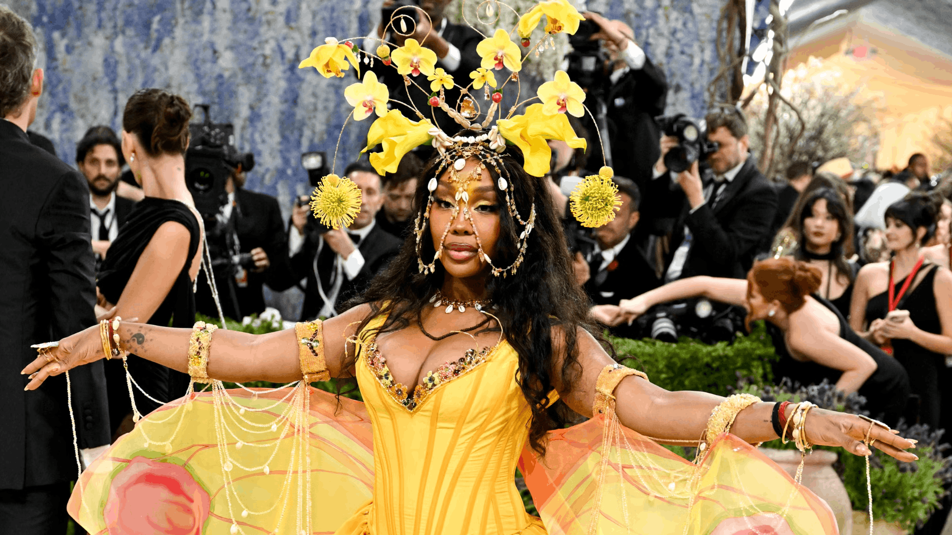 SZA in a yellow BODE gown sourced from vintage materials, representing the divine feminine.