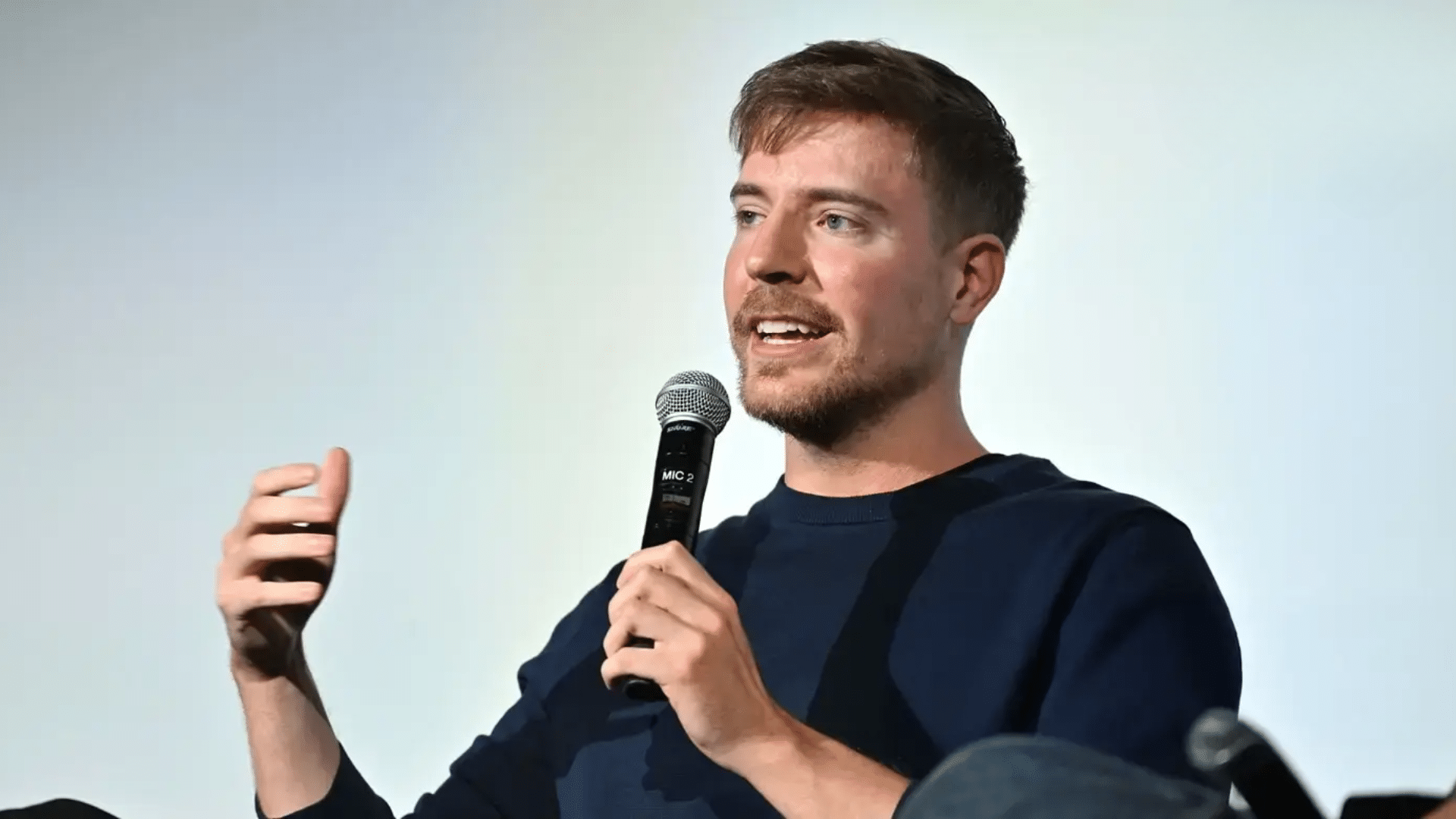 Close-up of MrBeast’s smile showing straight, bright, and well-aligned teeth, highlighting a polished and camera-ready appearance likely enhanced with cosmetic dental work.