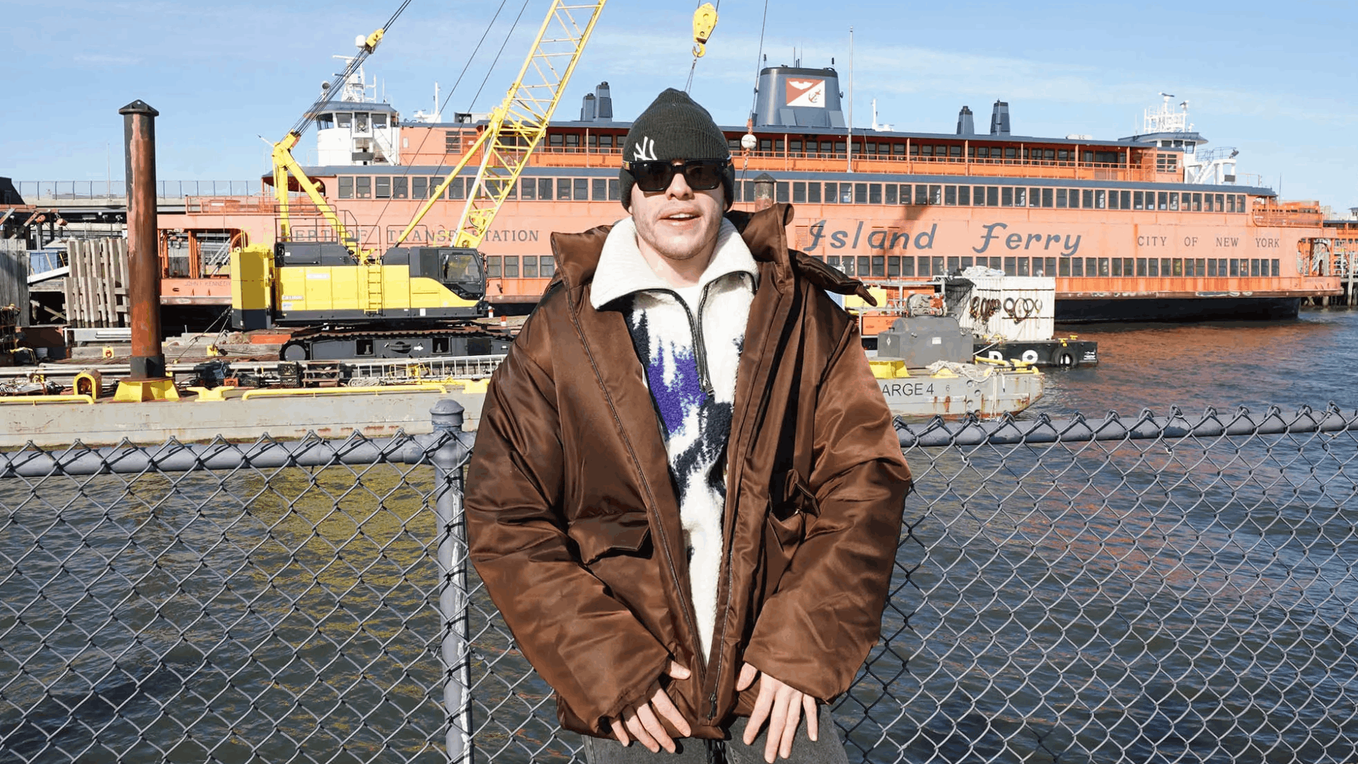 Pete Davidson Posing in front of his Staten Island Ferry.