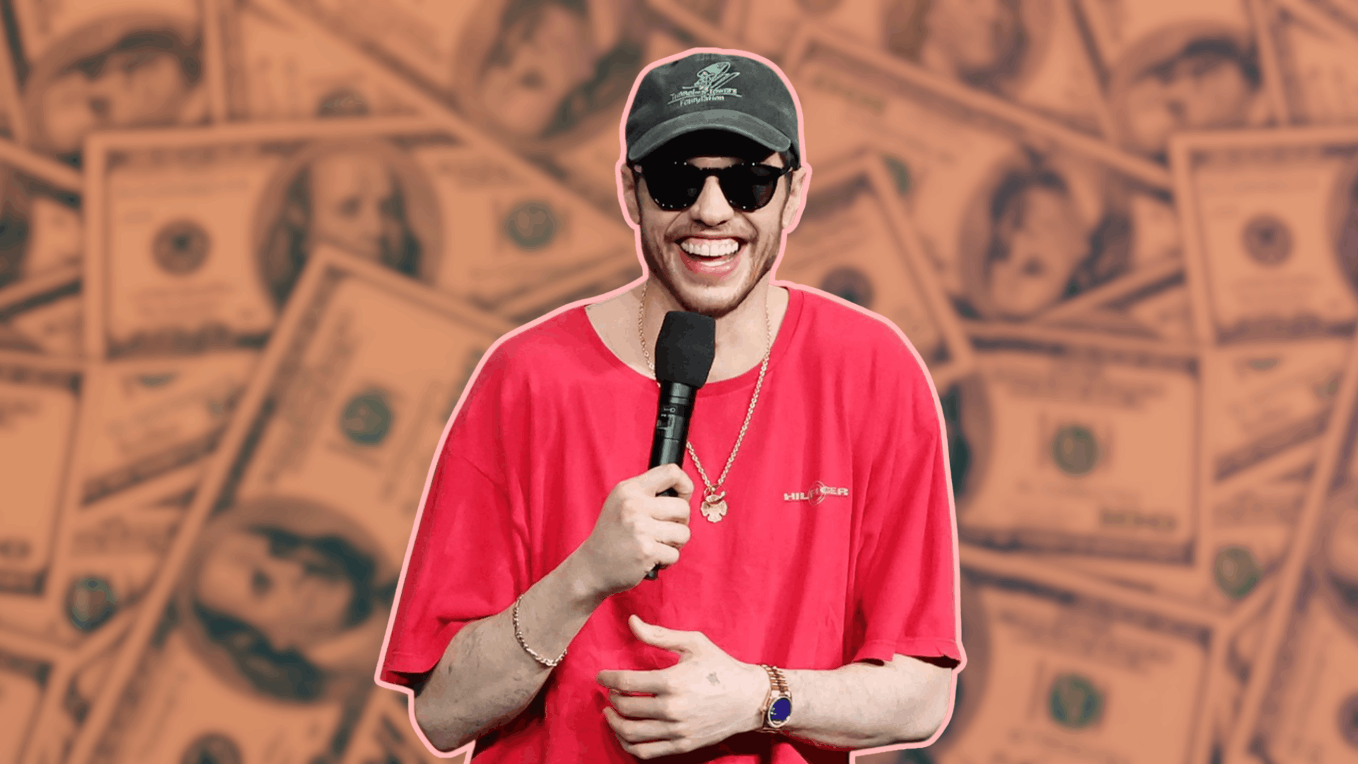 Pete Davidson wearing sunglasses and a red t-shirt, holding a microphone, with a background of stylized dollar bills.