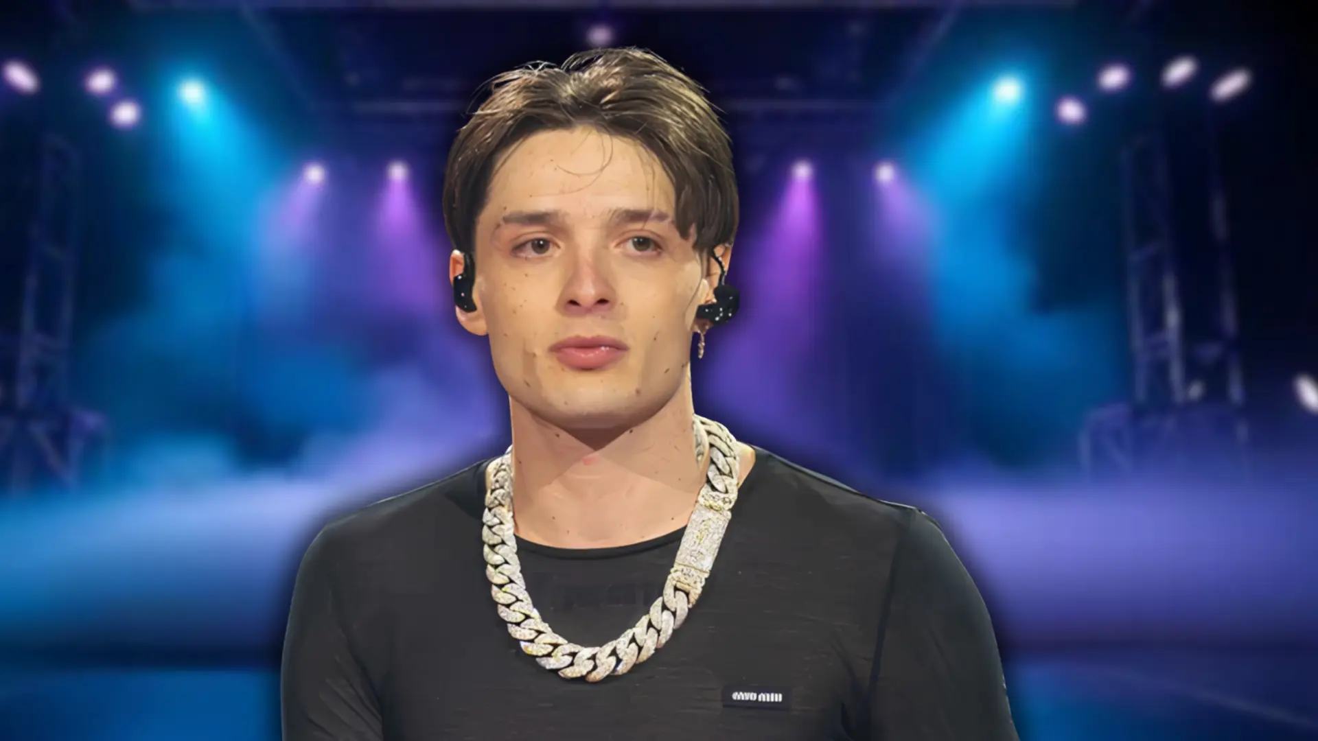 Peso Pluma with his sleek rocker-inspired Tommy Lee phase haircut and diamond chain against a stage backdrop.