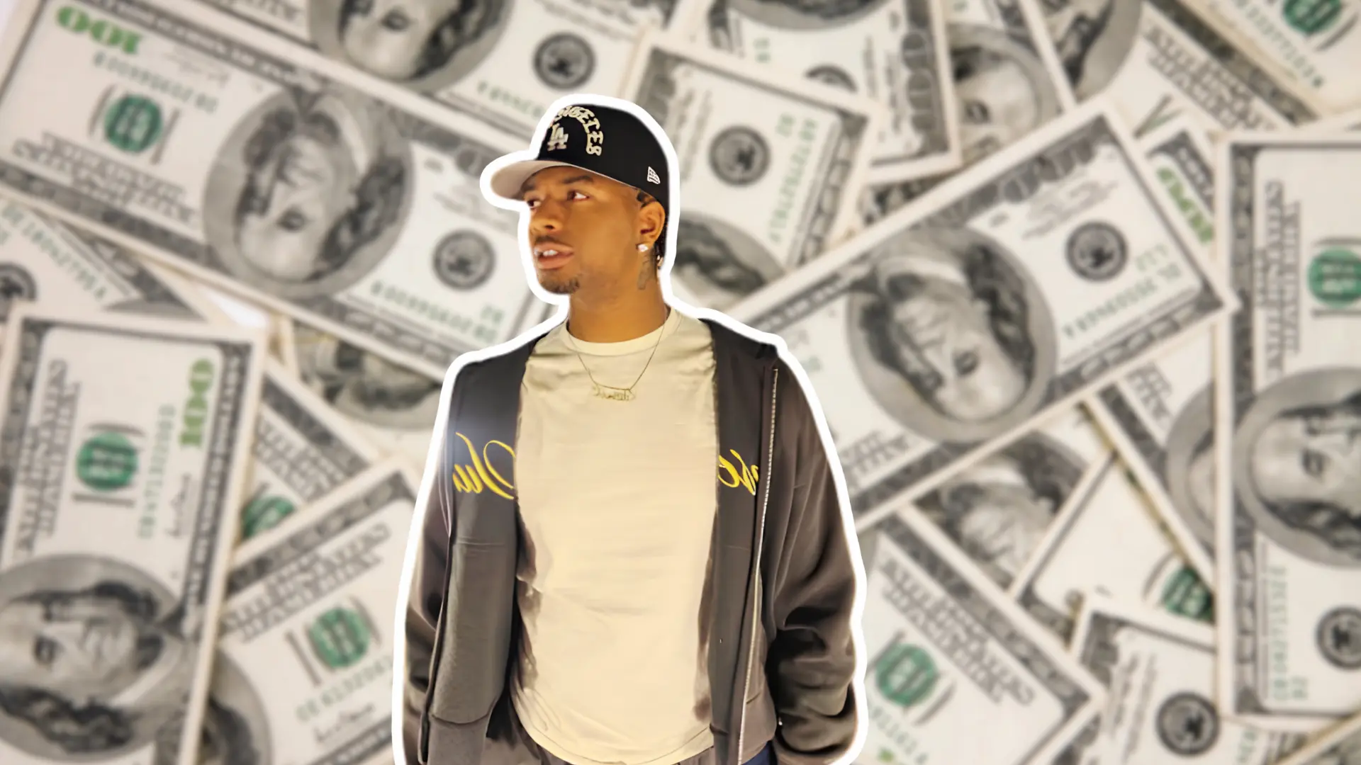 Wayne Deuce in a grey jacket and LA cap surrounded by hundred dollar bills representing his estimated net worth in 2026.