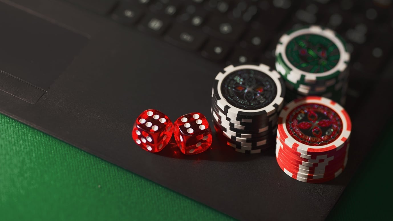 A close-up of poker chips and dice AI-generated content may be incorrect.